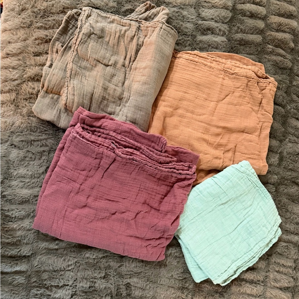 Set of Four MomCozy Muslim Swaddles in Assorted Colors.